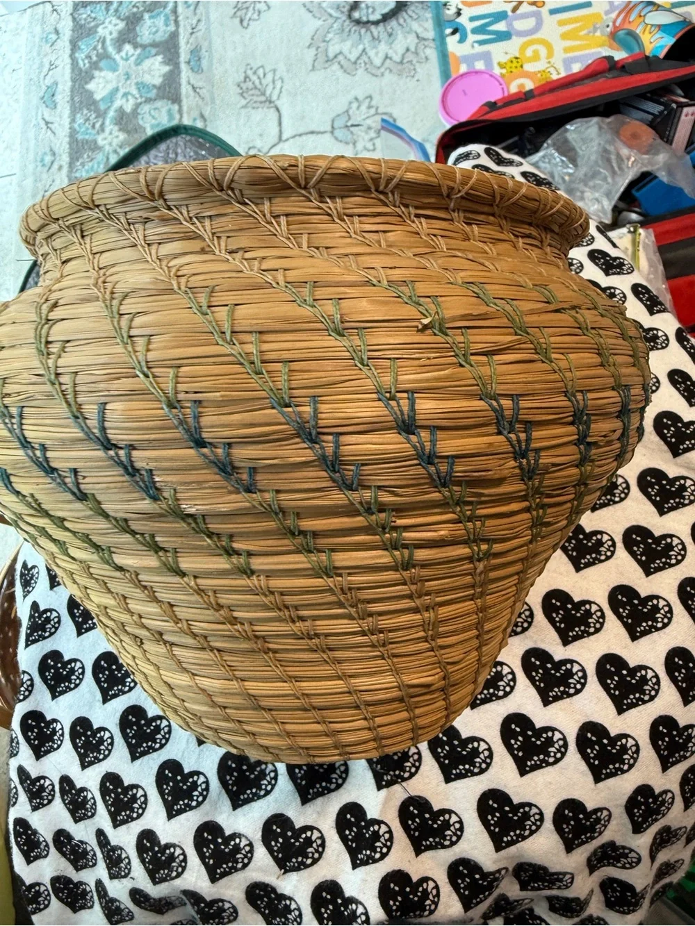 vintage Native American style pine needle basket, similar to those identified